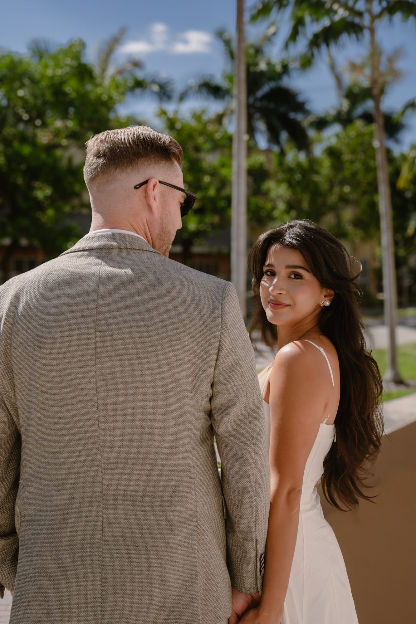 Couple portrait with palm trees in the background