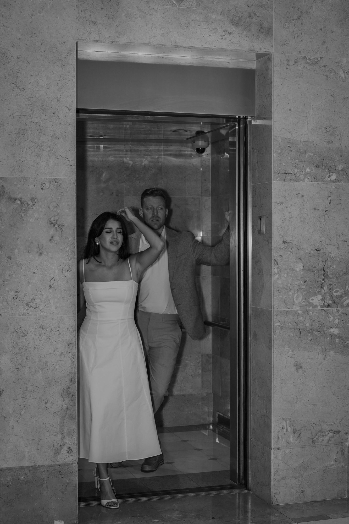 Candid black and white moment of a couple close together