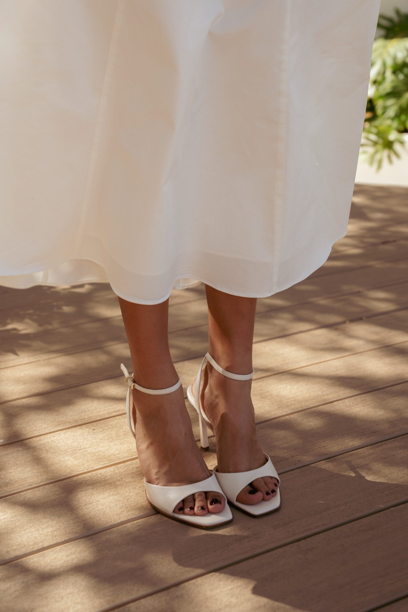 Detail of the bride's shoes beneath her gown