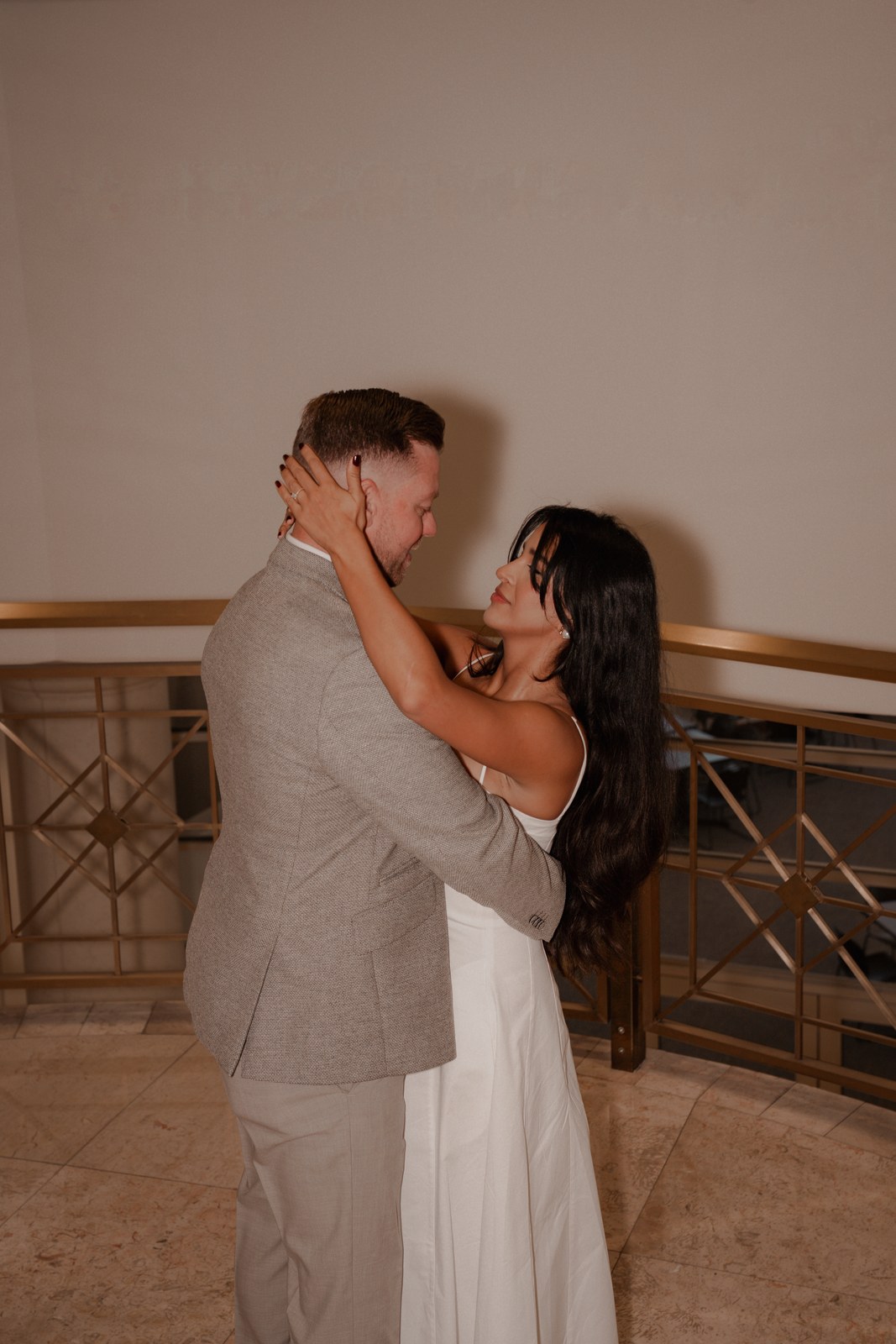 Couple holding each other close, foreheads touching